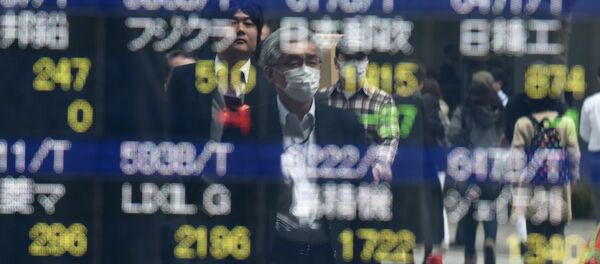 Pedestrians are reflected on an electronic stock quotation board at the window of a securities company in Tokyo on April 8, 2016 Pedestrians are reflected on an electronic stock quotation board at the window of a securities company in Tokyo on April 8, 2016 - Sputnik International