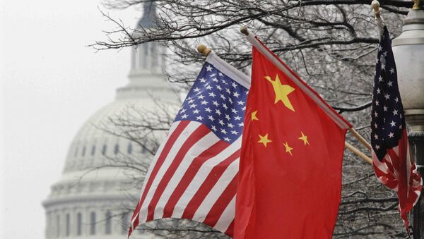The Capitol dome is seen at rear as Chinese and U.S. flags are displayed in Washington, Tuesday, Jan. 18, 2011 - Sputnik International