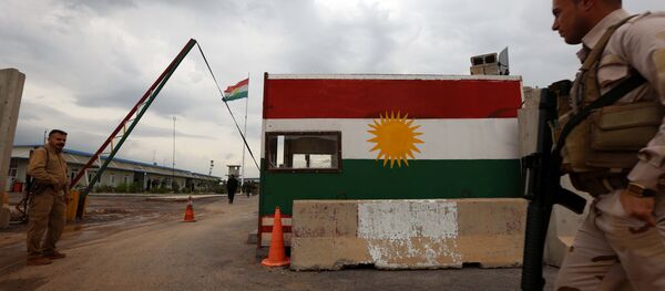 Members of the Iraqi Kurdish Peshmerga forces stand in Khazir near the Kurdish checkpoint of Aski Kalak, 40 kilometres West of Arbil, the capital of the autonomous Kurdish region of northern Iraq on April 12, 2016 - Sputnik International