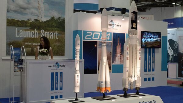 This photograph taken on June 16, 2014 shows the display booth of Arianespace, the European satellite launch company at the CommunicAsia and BroadcastAsia exhibition in Singapore - Sputnik International