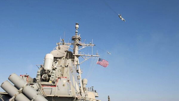 An U.S. Navy picture shows what appears to be a Russian Sukhoi SU-24 attack aircraft flying over the U.S. guided missile destroyer USS Donald Cook in the Baltic Sea in this picture taken April 12, 2016 and released April 13, 2016 - Sputnik International