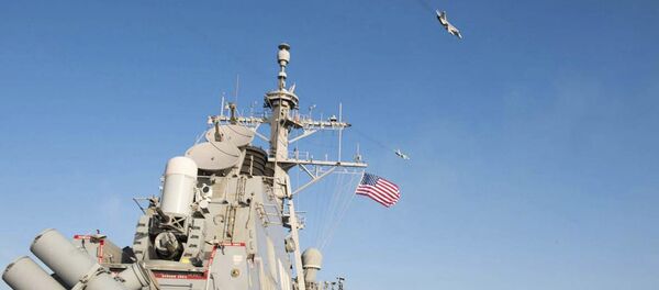 An U.S. Navy picture shows what appears to be a Russian Sukhoi SU-24 attack aircraft flying over the U.S. guided missile destroyer USS Donald Cook in the Baltic Sea in this picture taken April 12, 2016 and released April 13, 2016 - Sputnik International
