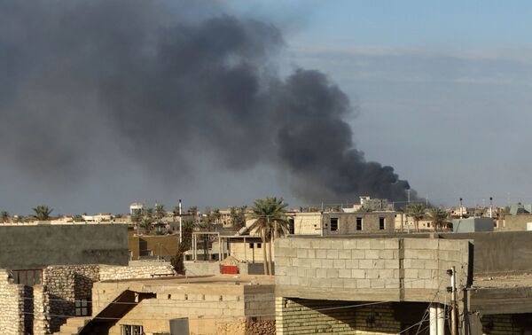 In this Monday, Jan. 4, 2016 photo, smoke rises from Islamic State positions following a U.S.-led coalition airstrike in Ramadi, 70 miles (115 kilometers) west of Baghdad, Iraq In this Monday, Jan. 4, 2016 photo, smoke rises from Islamic State positions following a U.S.-led coalition airstrike in Ramadi, 70 miles (115 kilometers) west of Baghdad, Iraq - Sputnik International