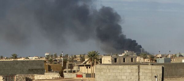 In this Monday, Jan. 4, 2016 photo, smoke rises from Islamic State positions following a U.S.-led coalition airstrike in Ramadi, 70 miles (115 kilometers) west of Baghdad, Iraq In this Monday, Jan. 4, 2016 photo, smoke rises from Islamic State positions following a U.S.-led coalition airstrike in Ramadi, 70 miles (115 kilometers) west of Baghdad, Iraq - Sputnik International