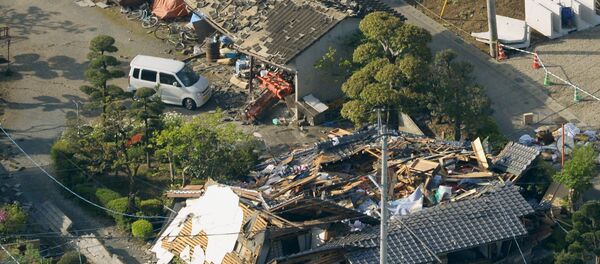 Collapsed houses caused by an earthquake are seen in Mashiki town, Kumamoto prefecture, southern Japan, in this photo taken by Kyodo April 15, 2016 Collapsed houses caused by an earthquake are seen in Mashiki town, Kumamoto prefecture, southern Japan, in this photo taken by Kyodo April 15, 2016 - Sputnik International