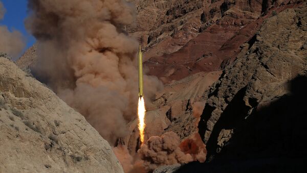 A Qadr H long-range ballistic surface-to-surface missile is fired by Iran's powerful Revolutionary Guard during a maneuver. file photo - Sputnik International