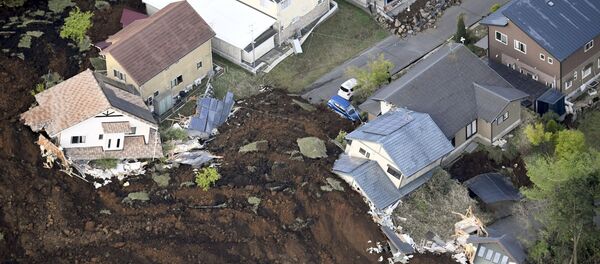 The aftermath of a landslide and destroyed houses caused by an earthquake are seen in Minamiaso town, Kumamoto prefecture, southern Japan, in this photo taken by Kyodo April 16, 2016 - Sputnik International