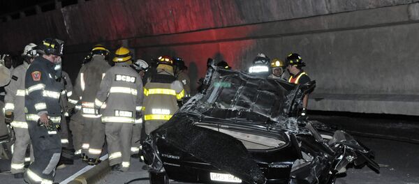 Rescue workers stand before a destroyed car after the collapse of a bridge in an earthquake, April 16, 2016 in Guayaquil, Ecuador Rescue workers stand before a destroyed car after the collapse of a bridge in an earthquake, April 16, 2016 in Guayaquil, Ecuador - Sputnik International