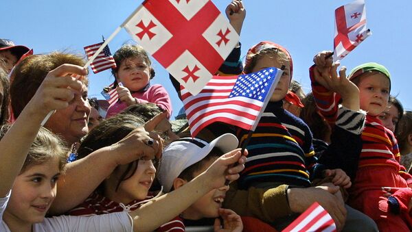 Children wave Georgian and US flags at Freedom Square in the Georgian capital Tbilisi (File) - Sputnik International