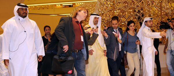 Kuwaiti Minister of Finance and Minister of Oil Anas al-Saleh (C) arrives for the organization of Petroleum Exporting Countries (OPEC) meeting, in the Qatari capital Doha, on April 17, 2016 - Sputnik International