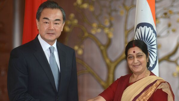 Chinese Foreign Minister Wang Yi (left) and Indian Foreign Minister Sushma Swaraj.(File) - Sputnik International