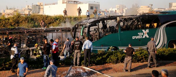 Emergency workers search the scene after a blast on a bus in Jerusalem Emergency workers search the scene after a blast on a bus in Jerusalem - Sputnik International