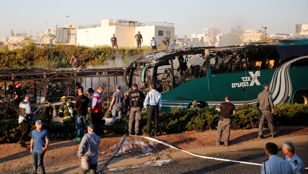 Emergency workers search the scene after a blast on a bus in Jerusalem - Sputnik International