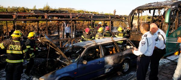 Emergency workers search the scene after a blast on a bus in Jerusalem Emergency workers search the scene after a blast on a bus in Jerusalem - Sputnik International