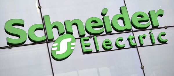The logo of electricity distribution and energy management group Schneider Electric at the company's headquarters in Rueil-Malmaison, outside Paris - Sputnik International