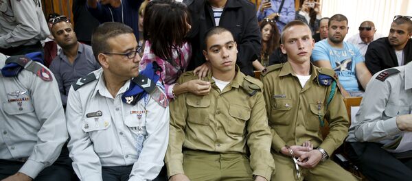 The father (C, back) of Israeli soldier Elor Azaria (C, seated), who is charged with manslaughter by the Israeli military - Sputnik International