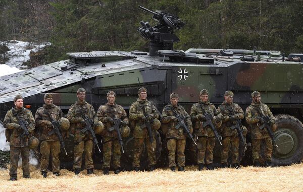 Mountain infantry soldiers stand in front of a troops transporter Boxer after an exercise of the mountain infantry brigade 23 of the German Bundeswehr near the Bavarian village Bad Reichenhall, southern Germany, on March 23, 2016 Mountain infantry soldiers stand in front of a troops transporter Boxer after an exercise of the mountain infantry brigade 23 of the German Bundeswehr near the Bavarian village Bad Reichenhall, southern Germany, on March 23, 2016 - Sputnik International