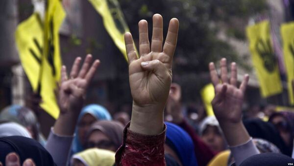 Pro-Brotherhood protesters raise their hands with the Rabia gesture during a march - Sputnik International