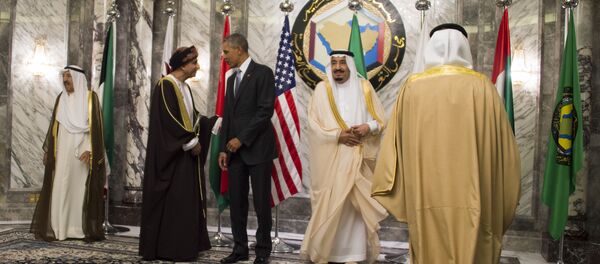 King of Saudi Arabia Salman bin Abdulaziz al-Saud (2nd L) looks on a s US President Barack Obama (3rd L) speaks with Oman Deputy Prime Minister for the Council of Ministers Sayyid Fahd bin Mahmoud al-Said (2nd L) during the family photo for the US-Gulf Cooperation Council Summit in Riyadh, on April 21, 2016 - Sputnik International