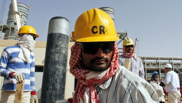 Oil workers are seen at the Khurais oil facility in an area where operations are being expanded, about 60 miles southeast of Riyadh, Saudi Arabia (File) - Sputnik International