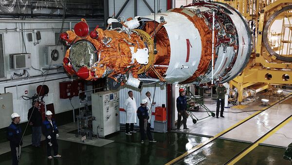 Rocket-and-space industry experts prepare the Resurs-P No. 3 remote-sensing Earth surface observation satellite for launch at Baikonur Cosmodrome. File photo - Sputnik International