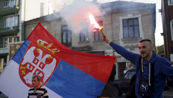 A supporter of Radical Party lights a flare before pre-election rally in Jagodina, Serbia (File) - Sputnik International