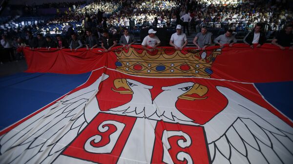 Serbian Progressive Party supporters hold Serbian flag during a pre-election rally in Belgrade, Serbia, Thursday, April 21, 2016 - Sputnik International