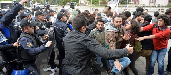 Riot police use tear gas to disperse demonstrators during a protest against parliament speaker Ismail Kahraman, outside the Turkish parliament in Ankara, Turkey April 26, 2016. Riot police use tear gas to disperse demonstrators during a protest against parliament speaker Ismail Kahraman, outside the Turkish parliament in Ankara, Turkey April 26, 2016. - Sputnik International