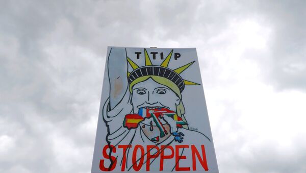 A placard is pictured during demonstration against TTIP free trade agreement ahead of U.S. President Barack Obama's visit in Hanover, Germany April 23, 2016. - Sputnik International