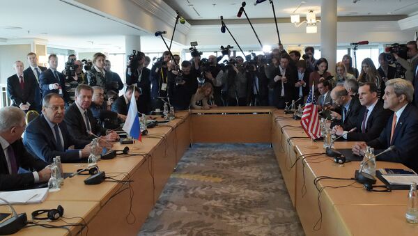 Russian Foreign Minister Sergei Lavrov (second left) and US Secretary of State John Kerry (right) participating in a bilateral meeting on the eve of an International Syria Support Group (ISSG) session in Munich. (File) - Sputnik International
