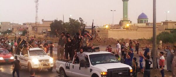 Fighters of the al-Qaida-inspired Islamic State of Iraq and the Levant (ISIL) parade in the northern city of Mosul, Iraq. (File) Fighters of the al-Qaida-inspired Islamic State of Iraq and the Levant (ISIL) parade in the northern city of Mosul, Iraq. (File) - Sputnik International