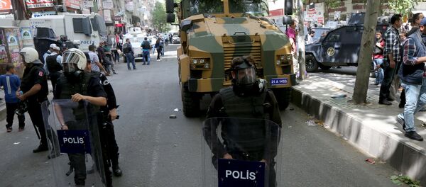 A Turkish military vehicle is surrounded by security forces after it hit and killed a local woman in an accident in the Kurdish-dominated southeastern city of Diyarbakir, Turkey April 27, 2016. A Turkish military vehicle is surrounded by security forces after it hit and killed a local woman in an accident in the Kurdish-dominated southeastern city of Diyarbakir, Turkey April 27, 2016. - Sputnik International