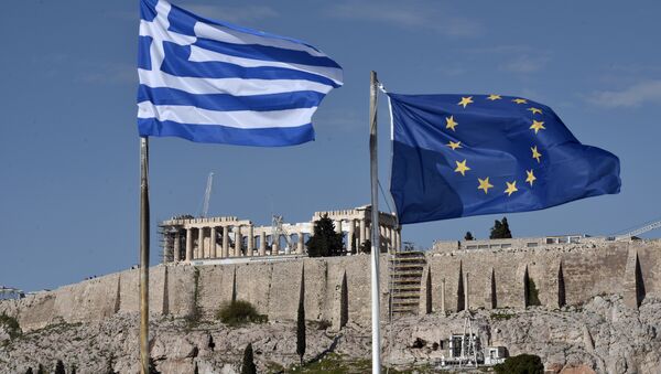 The Greek and EU flags flutter in front of the ancient Acropolis hill in Athens - Sputnik International