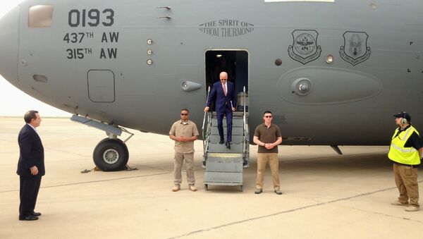 Vice President Joe Biden steps off a C-17 military transport plane upon his arrival in Baghdad, Iraq, Thursday, April 28, 2016. - Sputnik International