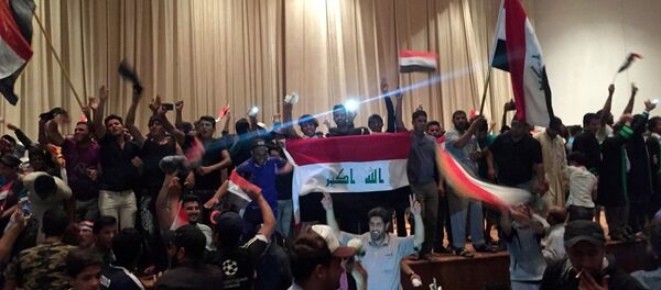 Followers of Iraq's Shi'ite cleric Moqtada al-Sadr are seen in the parliament building as they storm Baghdad's Green Zone after lawmakers failed to convene for a vote on overhauling the government, in Iraq April 30, 2016 Followers of Iraq's Shi'ite cleric Moqtada al-Sadr are seen in the parliament building as they storm Baghdad's Green Zone after lawmakers failed to convene for a vote on overhauling the government, in Iraq April 30, 2016 - Sputnik International