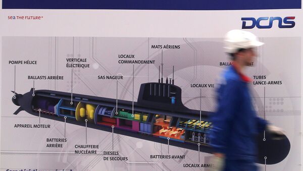 An employee walks past a poster showing a Barracuda submarine at the industrial site of the naval defence company and shipbuilder DCNS in La Montagne near Nantes, France, April 26, 2016 - Sputnik International