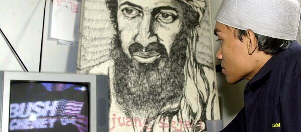 An Indonesian Muslim youth watches a television coverage of the US elections in front of a portrait of Osama bin Laden at a Islam youth movement headquarters in Jakarta, 03 November 2004 An Indonesian Muslim youth watches a television coverage of the US elections in front of a portrait of Osama bin Laden at a Islam youth movement headquarters in Jakarta, 03 November 2004 - Sputnik International