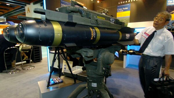 A man looks at the latest US-made Hellfire II missiles during at the defense industry exhibition in Taipei, 11 August 2005 - Sputnik International