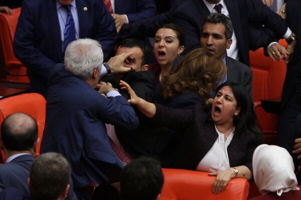 Ruling AK Party and pro-Kurdish Peoples' Democratic Party (HDP) lawmakers scuffle during a debate at the Parliament in Ankara, Turkey late April 27, 2016 - Sputnik International