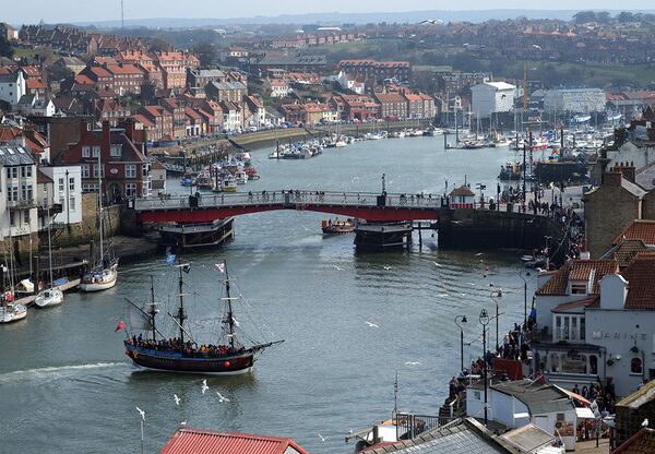 The three-masted boat in the foreground is a replica of Captain James Cook's ship, the Endeavour, 40% of the size of the original The three-masted boat in the foreground is a replica of Captain James Cook's ship, the Endeavour, 40% of the size of the original - Sputnik International