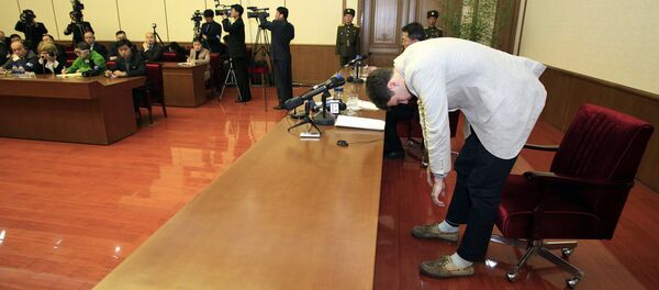 American student Otto Warmbier, right, bows as Warmbier is presented to the reporters on Monday, Feb. 29, 2016, in Pyongyang, North Korea - Sputnik International