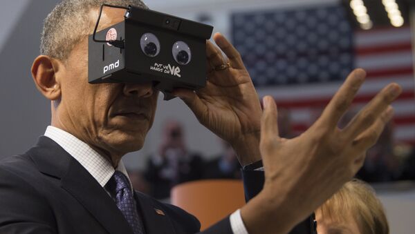 US President Barack Obama looks through a virtual reality device at the booth of German automation company ifm electronic as he tours with the German chancellor the Hanover industrial Fair in Hanover, central Germany, on April 25, 2016 - Sputnik International