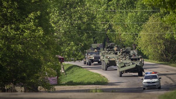 US military vehicles drive on a road in Sculeni, Moldova, Tuesday, May 3, 2016 - Sputnik International