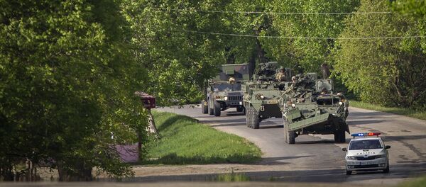 US military vehicles drive on a road in Sculeni, Moldova, Tuesday, May 3, 2016 US military vehicles drive on a road in Sculeni, Moldova, Tuesday, May 3, 2016 - Sputnik International