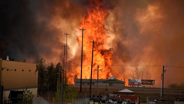 Flames rise in Industrial area south Fort McMurray, Alberta Canada May 3, 2016. - Sputnik International