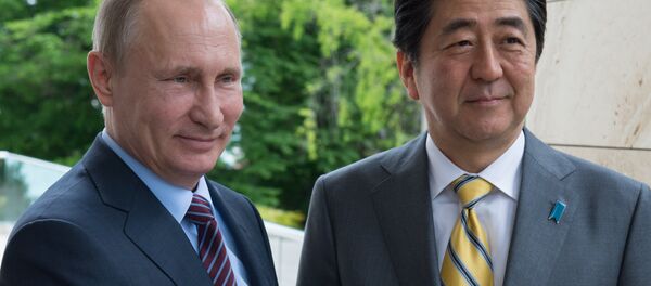 Russian President Vladimir Putin and Japanese Prime Minister Shinzo Abe shake hands at their meeting in the Bocharov Ruchei residence in Sochi, Russia, Friday, May 6, 2016 Russian President Vladimir Putin and Japanese Prime Minister Shinzo Abe shake hands at their meeting in the Bocharov Ruchei residence in Sochi, Russia, Friday, May 6, 2016 - Sputnik International