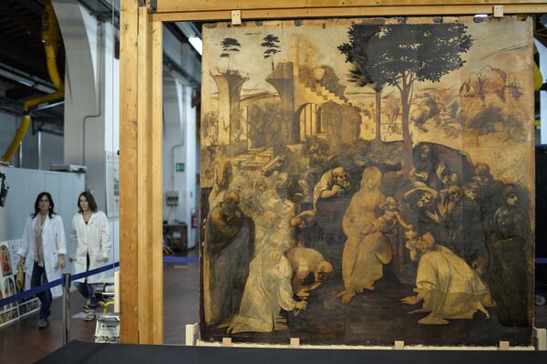 Restorers walk past the painting Adoration of the Magi (Adorazione dei Magi) representing a nativity scene by Italian Renaissance master Leonardo da Vinci, during its restoration in the Opificio delle Pietre Dure restoration laboratories at Fortezza da Basso, in Florence, on September 23, 2014. Restorers walk past the painting Adoration of the Magi (Adorazione dei Magi) representing a nativity scene by Italian Renaissance master Leonardo da Vinci, during its restoration in the Opificio delle Pietre Dure restoration laboratories at Fortezza da Basso, in Florence, on September 23, 2014. - Sputnik International