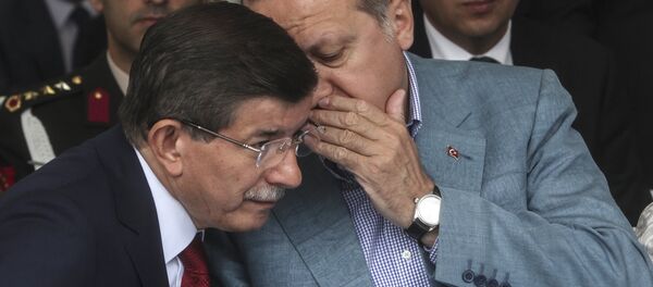 Turkey President Recep Tayyip Erdogan (R) speaks with Turkish prime minister Ahmet Davutoglu (L) (file) - Sputnik International