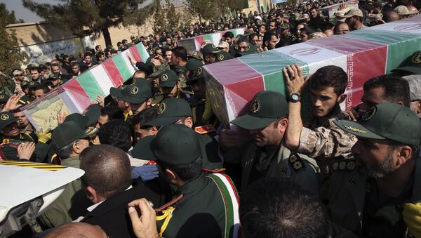 Civilians and armed forces members carry the flag draped coffins of Iranian Revolutionary Guard's Gen. Mohsen Ghajarian, right, and some of his comrades who were killed in fighting in Syria, during their funeral ceremony outside the headquarters of the guard's ground forces in Tehran, Iran, Saturday, Feb. 6, 2016. - Sputnik International
