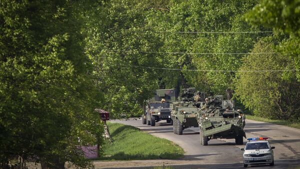 US military vehicles drive on a road in Sculeni, Moldova, Tuesday, May 3, 2016, as some 200 U.S. soldiers arrived in the country for more than two weeks of exercises, in a show of U.S. strength in the region - Sputnik International